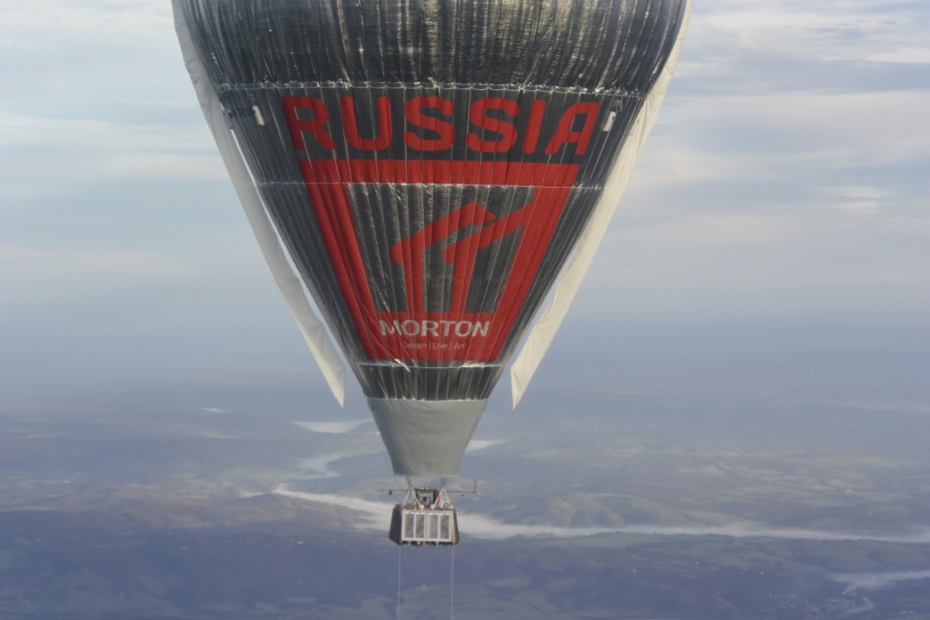 Russian adventurer Fedor Konyukhov floats at more than 6,000 meters (20,000 feet) above an area close to Northam in Western Australia in his helium and hot-air balloon.