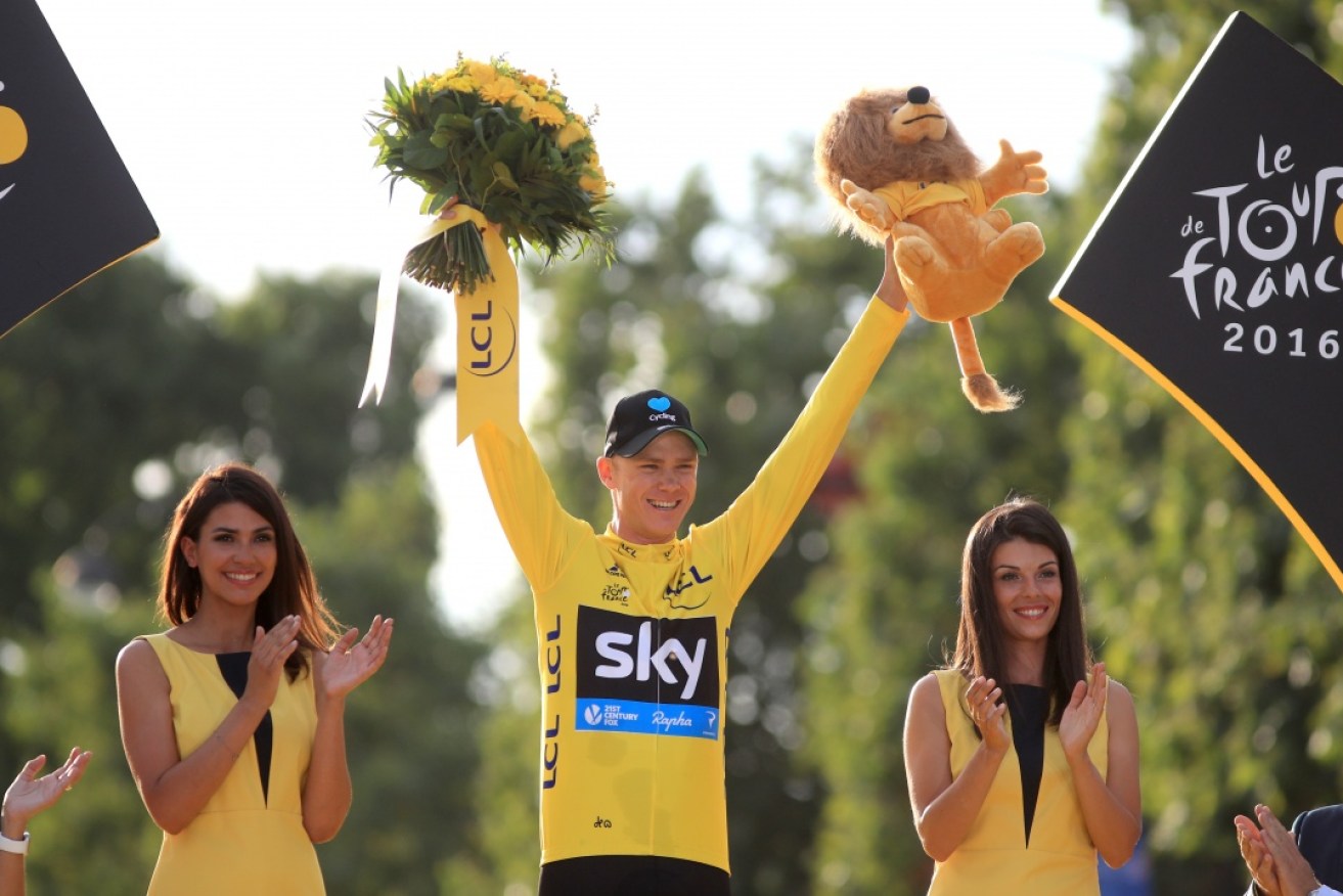 Team Sky's Chris Froome celebrates after winning his third Tour De France.