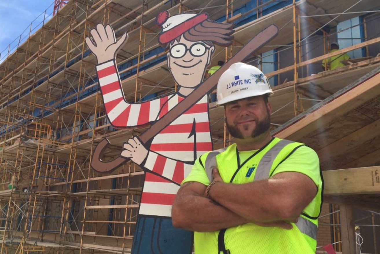 Construction foreman Jason Haney with his life-size Waldo.