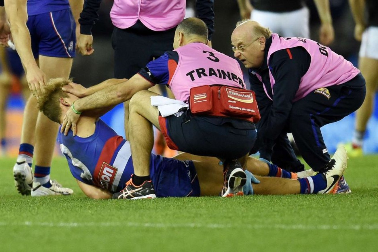 Mitch Wallis looked in agony as he was taken from the field with a broken leg.