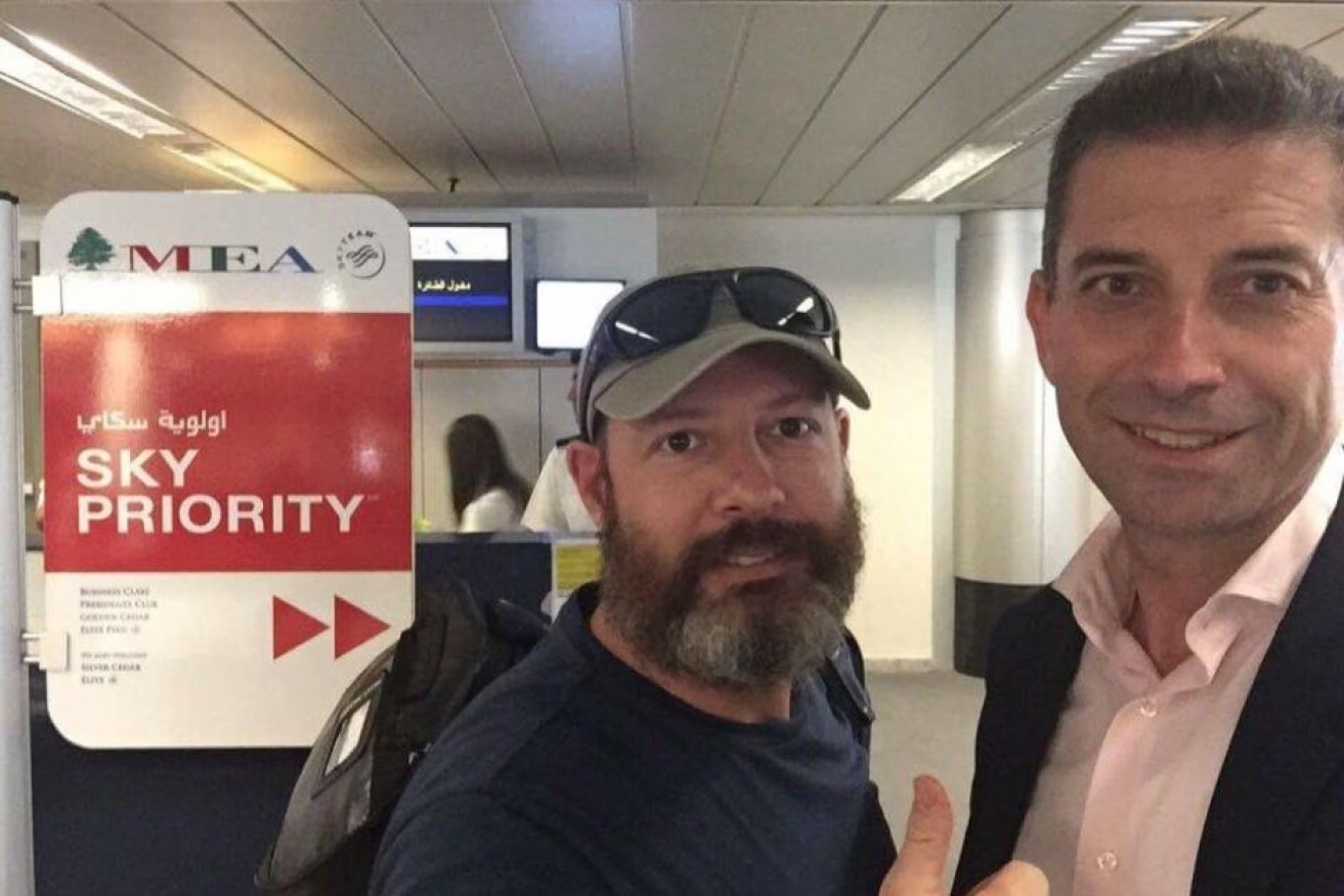 Adam Whittington, left,  at Beirut airport before his departure.