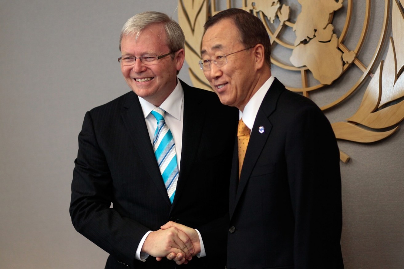 Former prime minister Kevin Rudd shakes hands with UN secretary-general Ban Ki-moon.