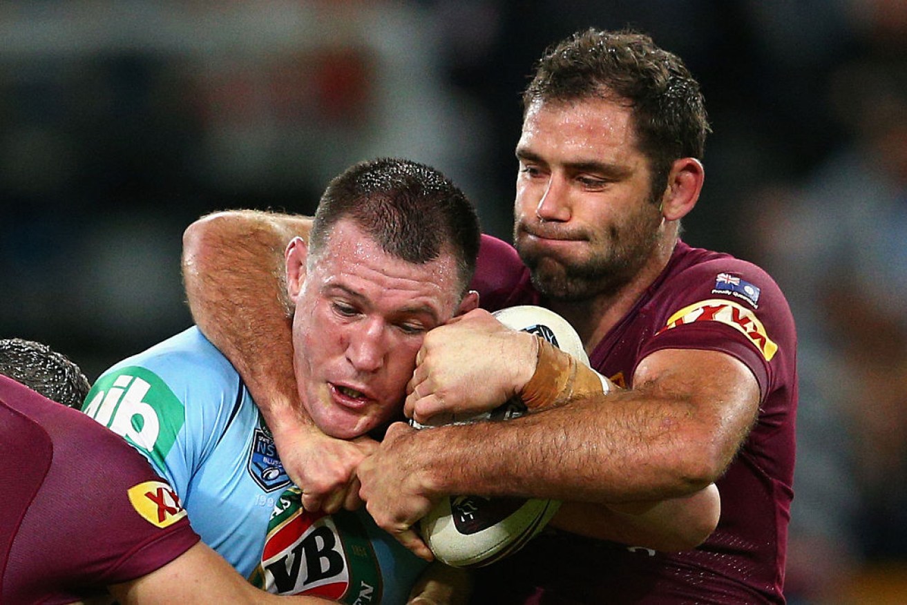 BRISBANE, AUSTRALIA - JULY 08:  Paul Gallen of the Blues is tackled by Maroons captain Cameron Smith during game three of the State of Origin series between the Queensland Maroons and the New South Wales Blues at Suncorp Stadium on July 8, 2015 in Brisbane, Australia.  (Photo by Cameron Spencer/Getty Images)