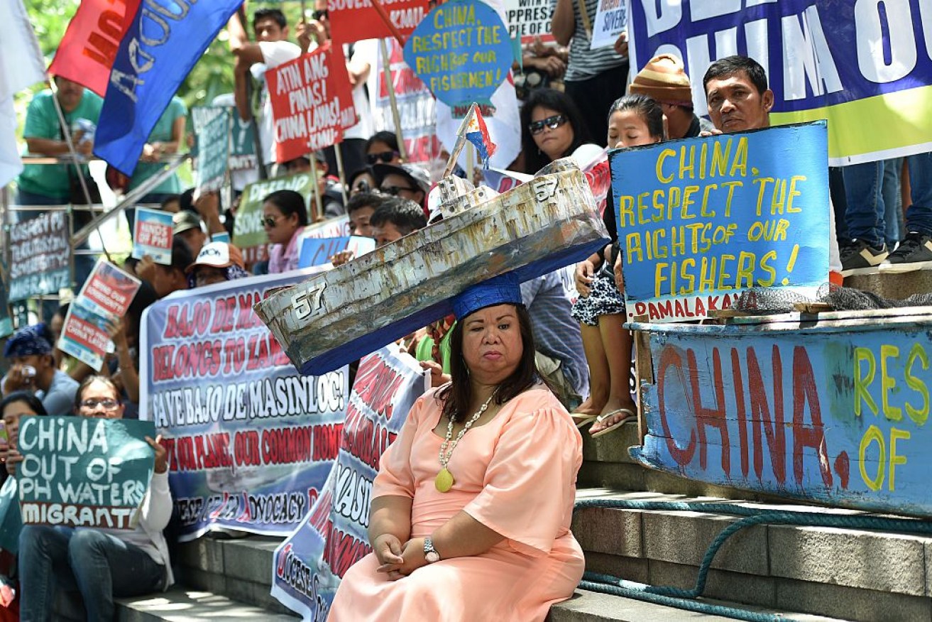 Protestors in the Philippines celebrating the decision. Photo: Getty