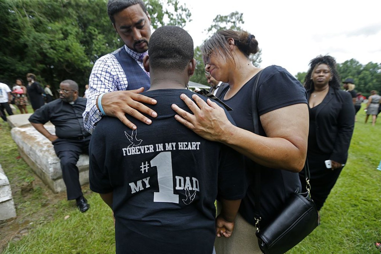 a'Quincy, 10, son of Alton Sterling, at his father's funeral. Photo: Getty.