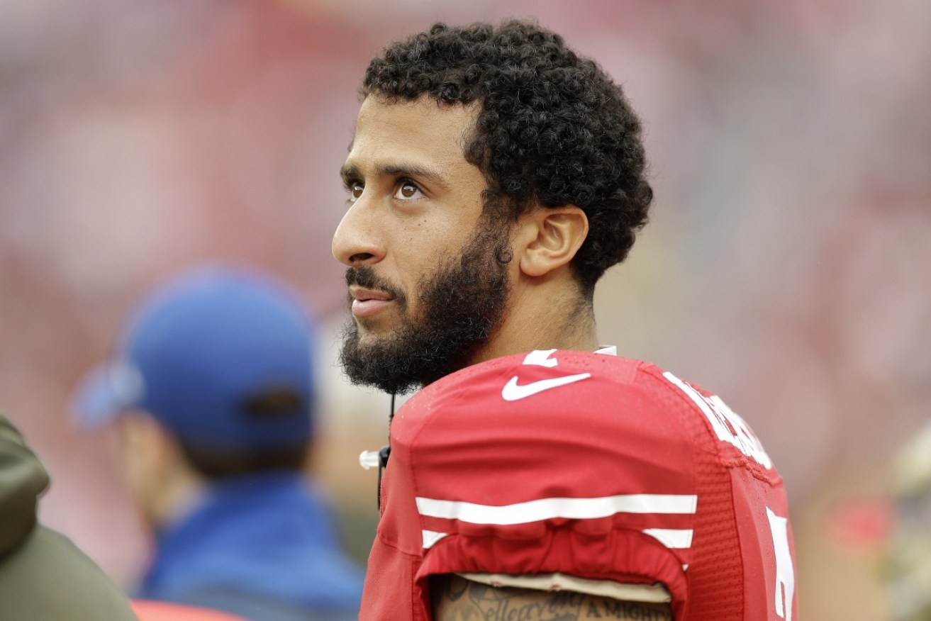 US outrage after San Franciso 49ers quarterback Colin Kaepernick makes stand during national anthem.