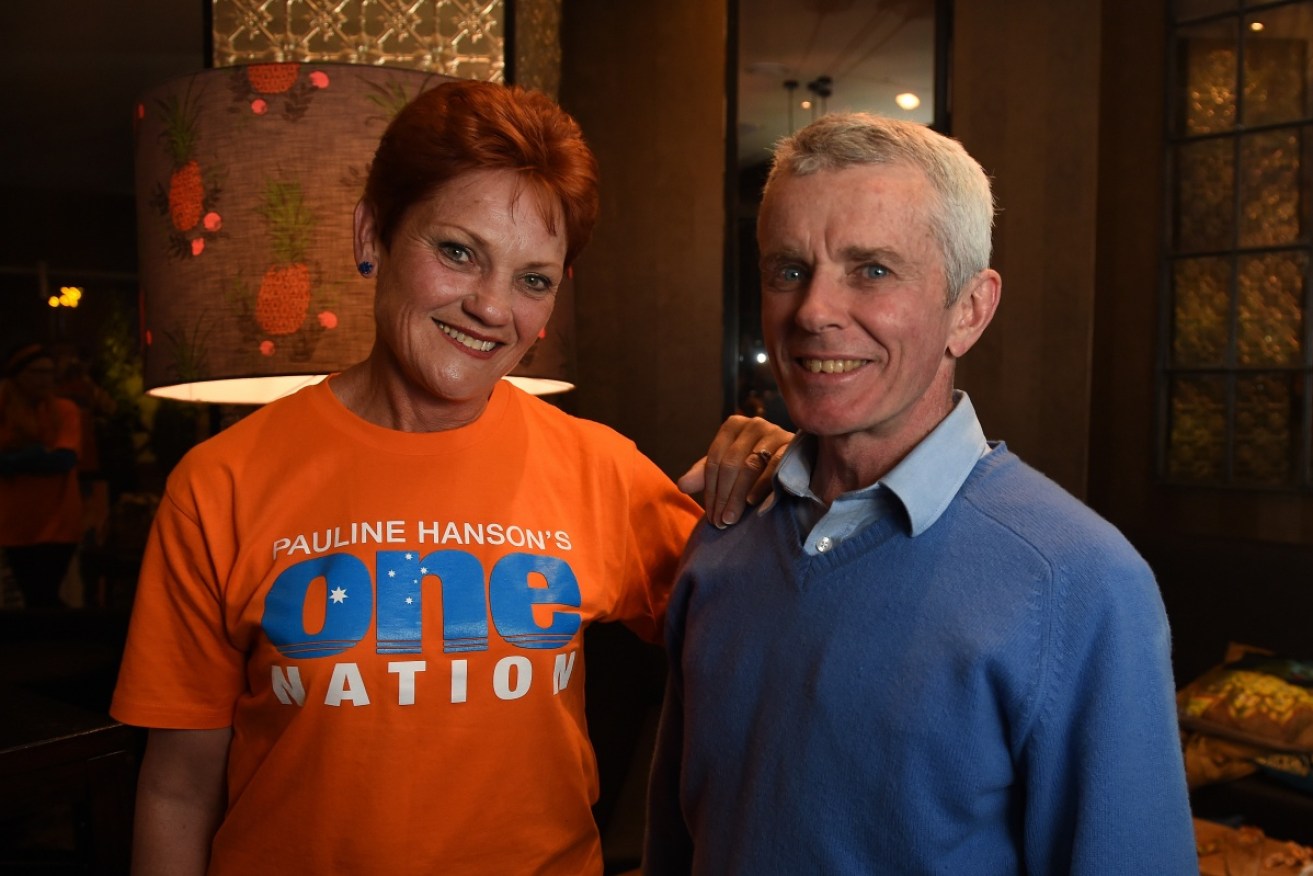 One Nation leader Pauline Hanson poses for a photo with Malcolm Roberts.