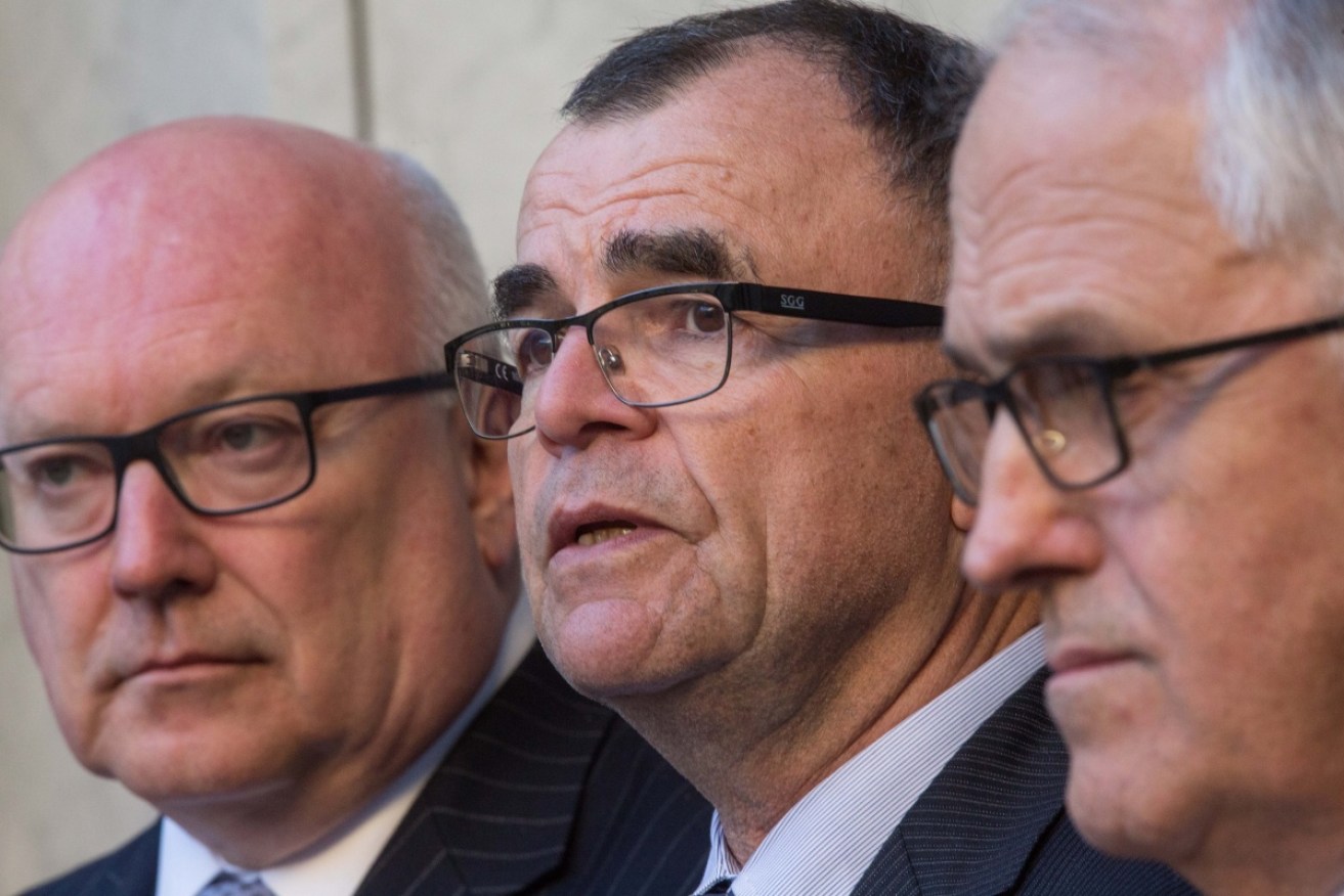 Brian Martin (c) with Attorney-General George Brandis (l) and Prime Minister Malcolm Turnbull.