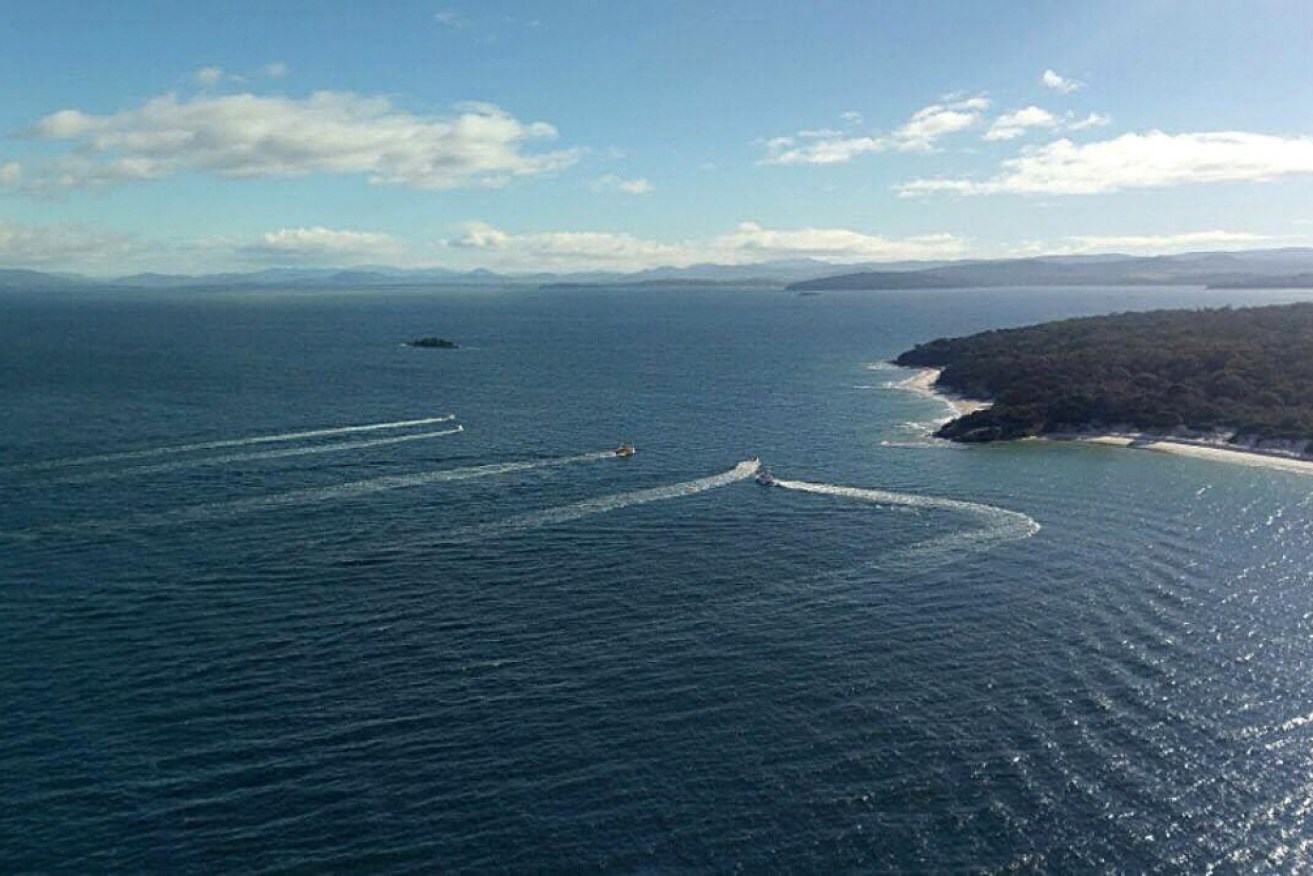 Search vessels near Hobart look for a missing runabout and two men.