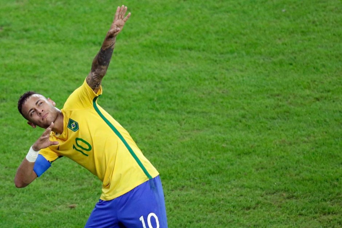 Neymar celebrates Brazil's first Olympic gold.