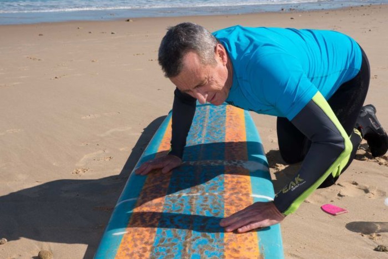 Neil Campbell created the wax, which he hopes will warn off sharks.