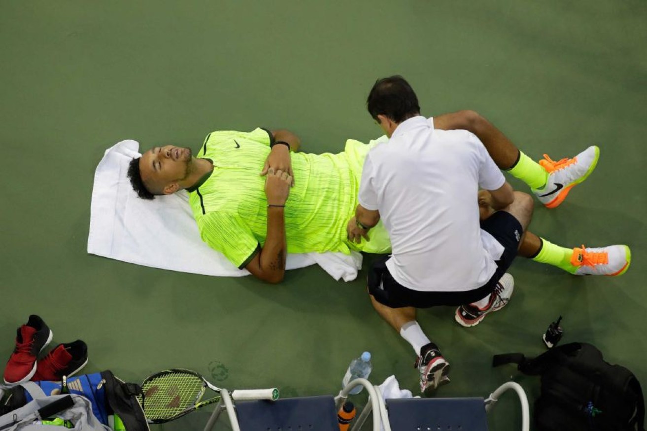 Nick Kyrgios had an interrupted straight sets win in round one at the US Open.