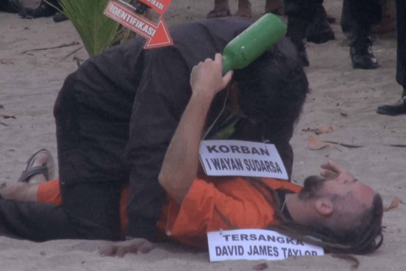 David Taylor during a re-enactment of the night he and partner Sara Connor allegedly murdered a Bali police officer.