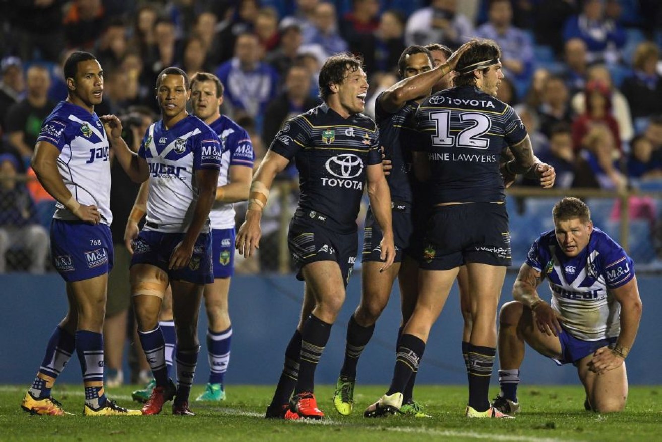 The Cowboys' Ethan Lowe (second from right) crossed for two tries.