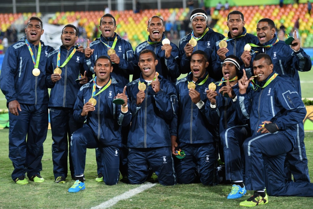 Gold medallists Fiji celebrate during the mens rugby sevens medal ceremony during the Rio 2016 Olympics. 