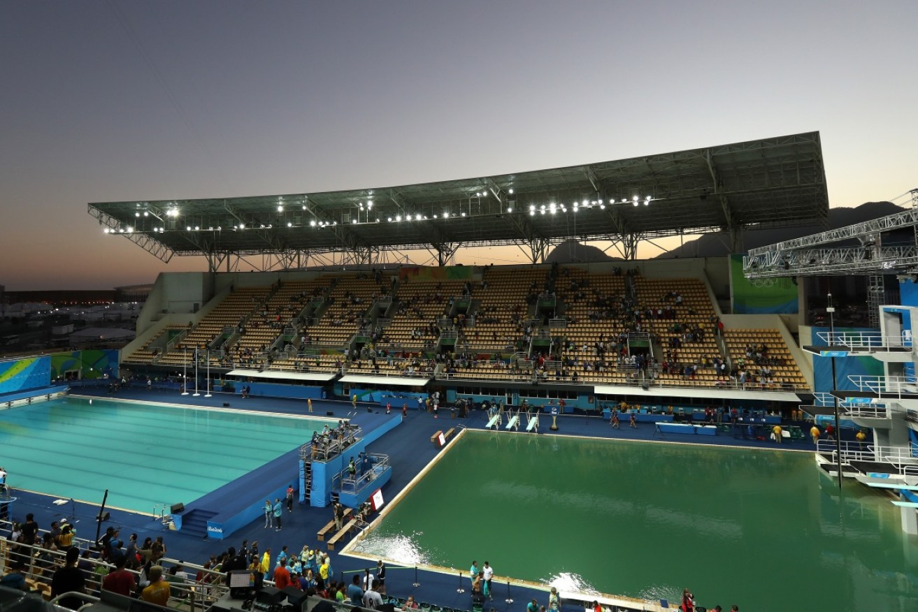 The green Olympic diving pool sits to the right of the 'cloudy' looking water polo pool. 