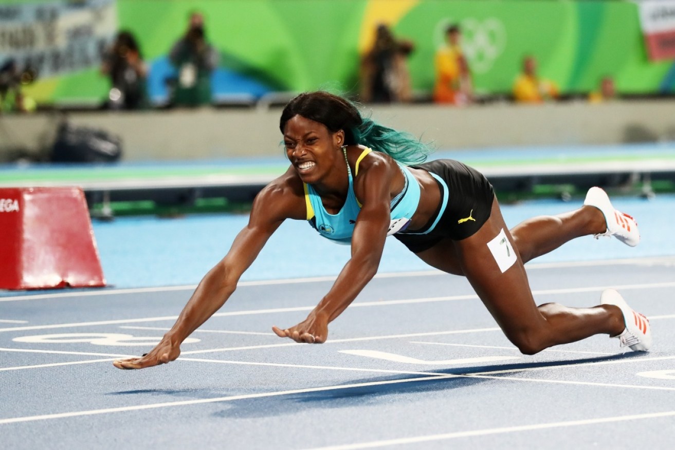Shaunae Miller of the Bahamas dives over the finish line to win the gold medal in the women's 400m final.