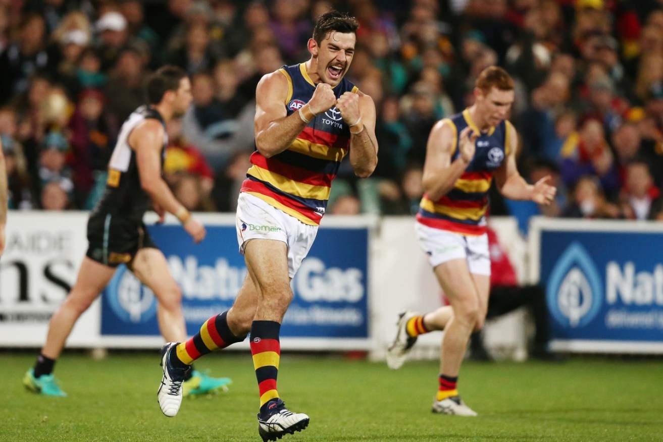 Taylor Walker's racist remarks have seen him booted from the game for six weeks.