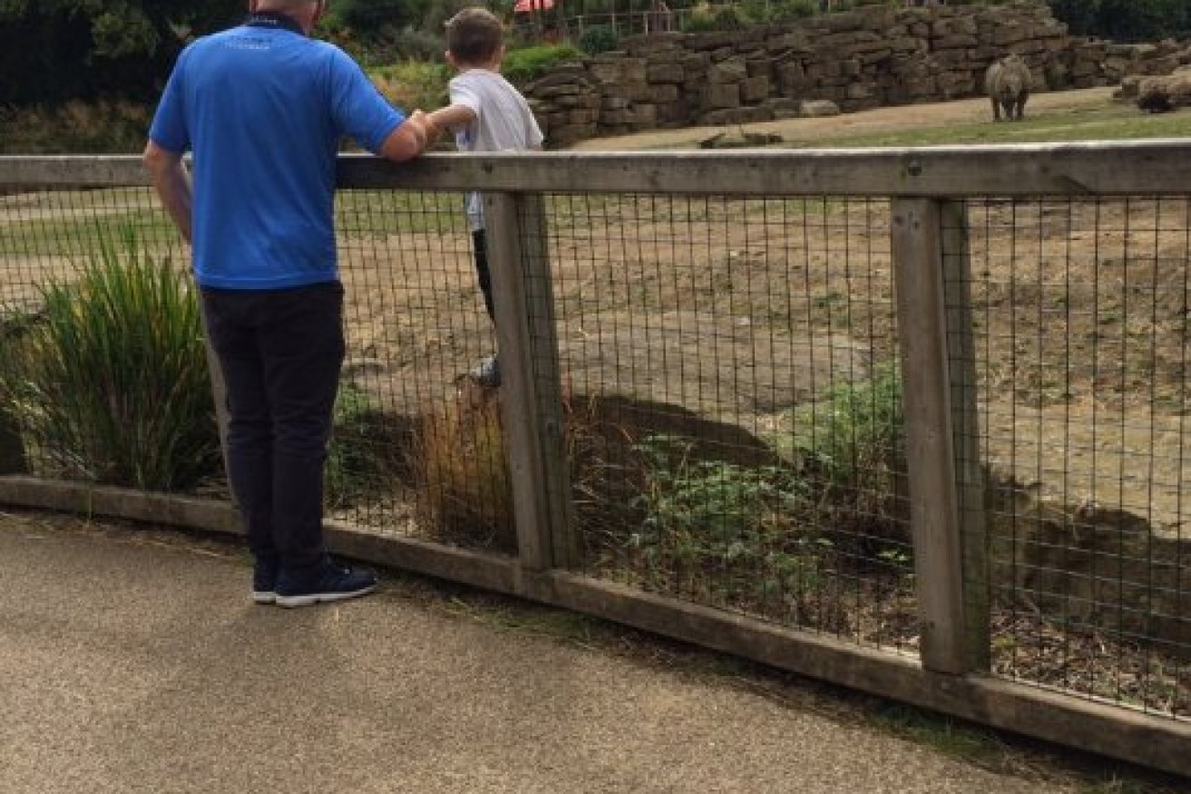 Images showing a child  inside a rhino enclosure spark controversy.