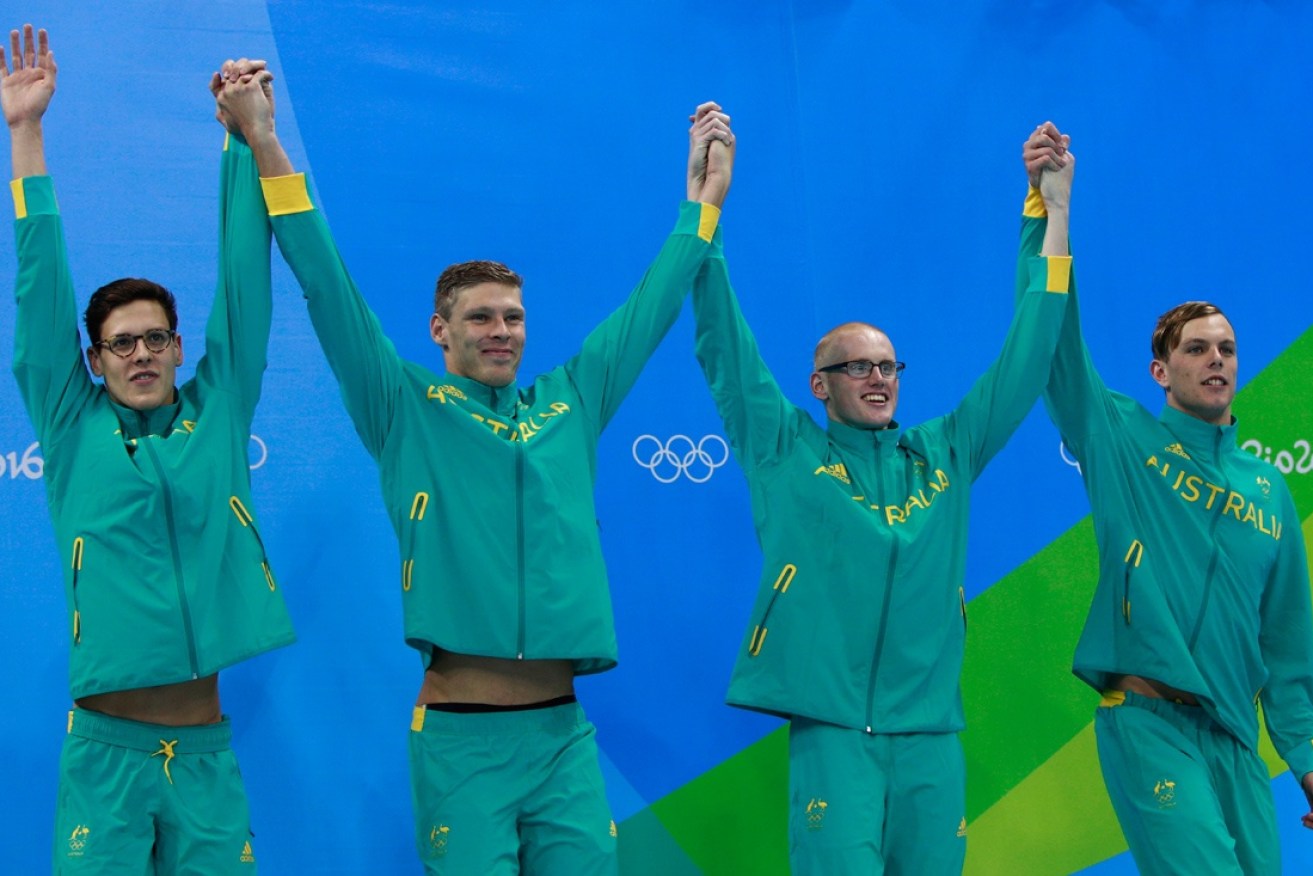 Australia celebrate their silver medal in the relay.
