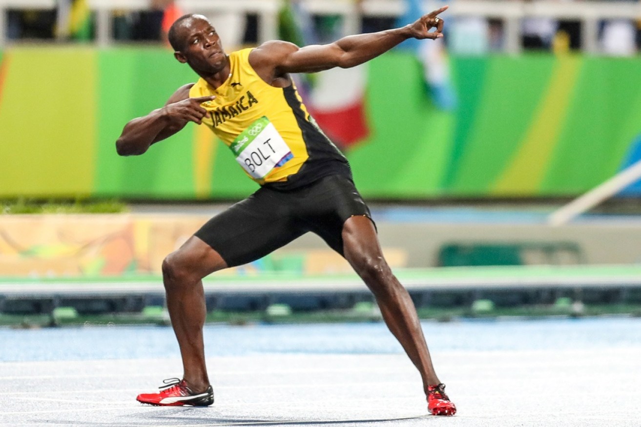 Bolt celebrates in trademark fashion.