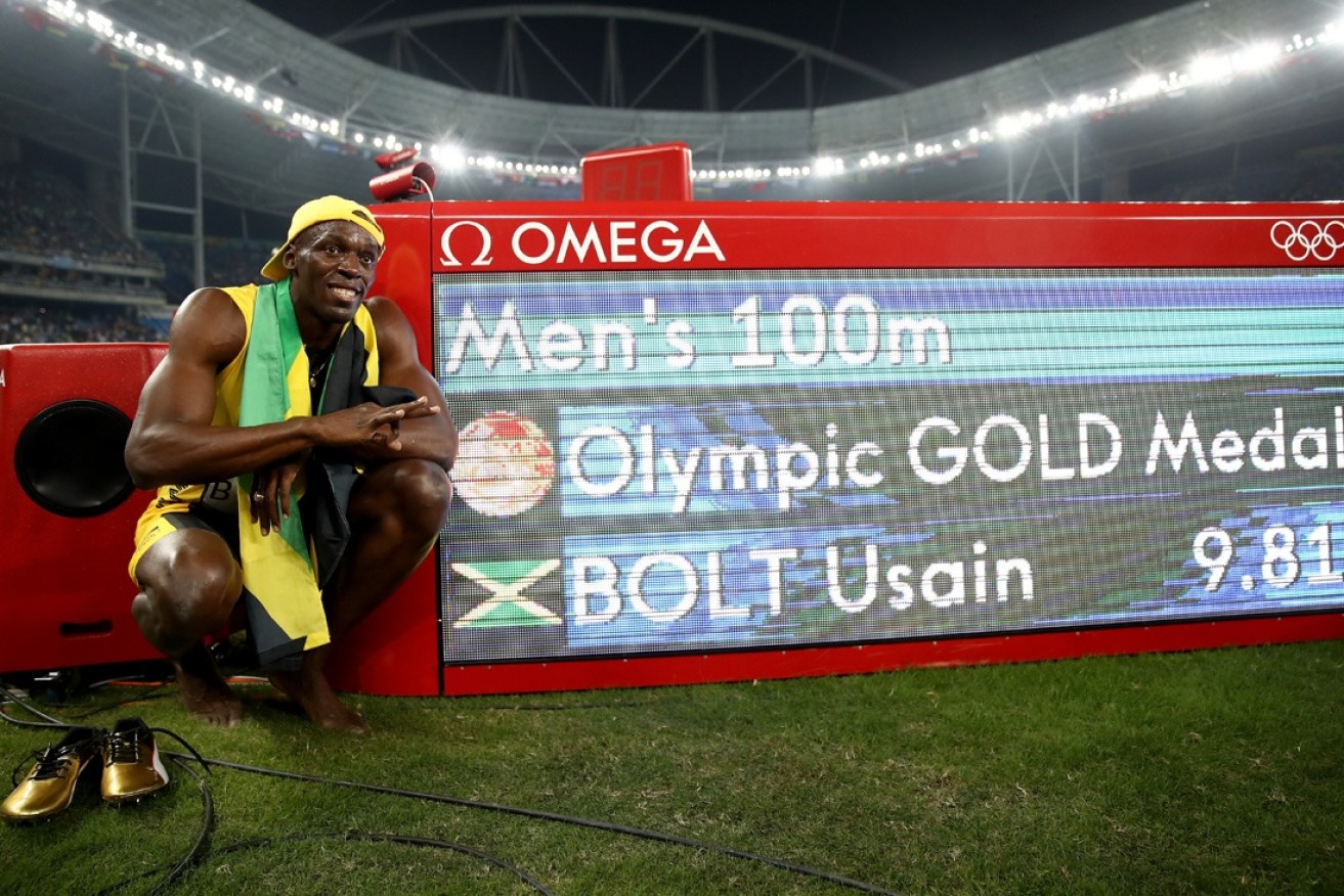 Bolt shows off his winning time.