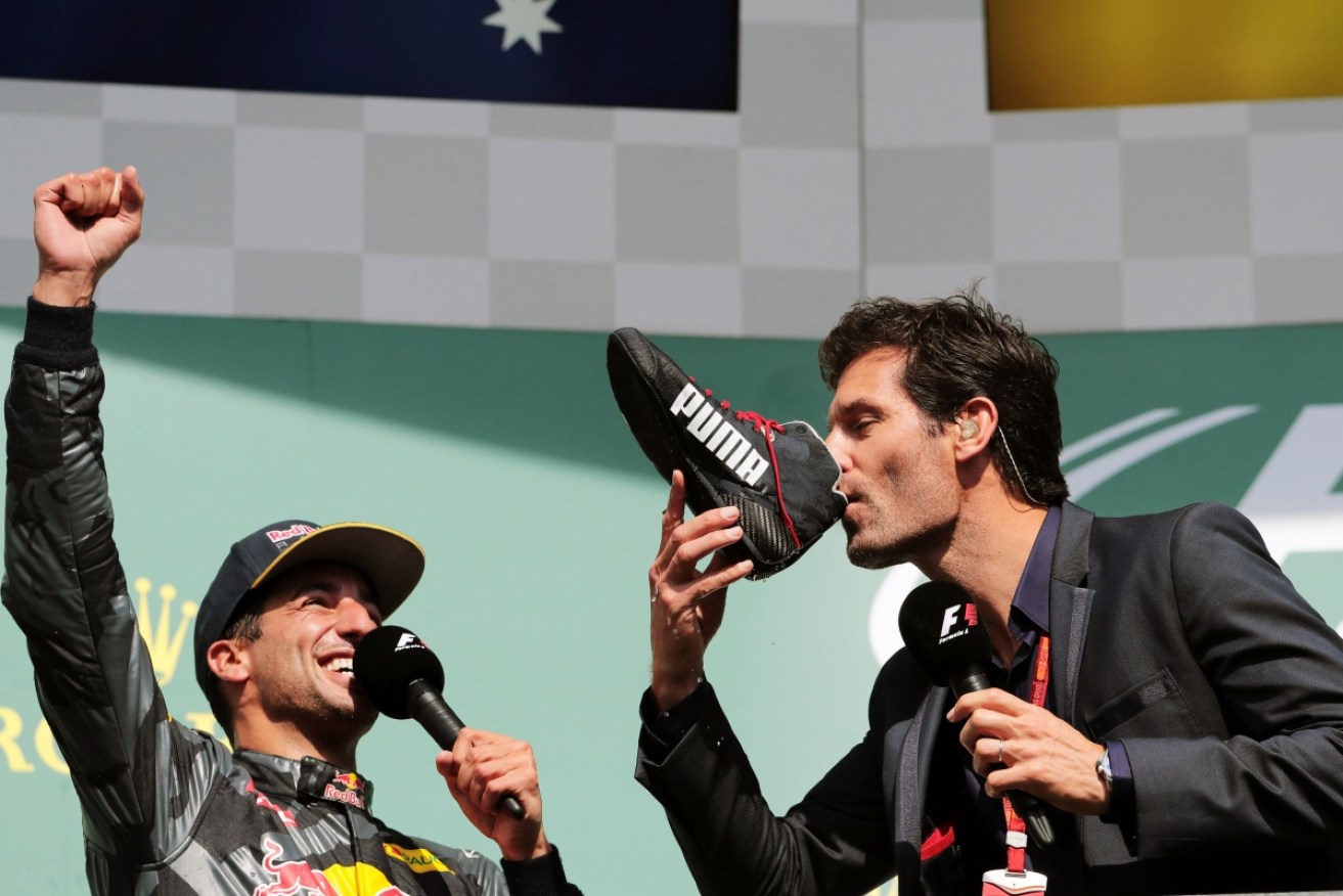 Mark Webber 'does a shoey' while Daniel Ricciardo cheers him on. 