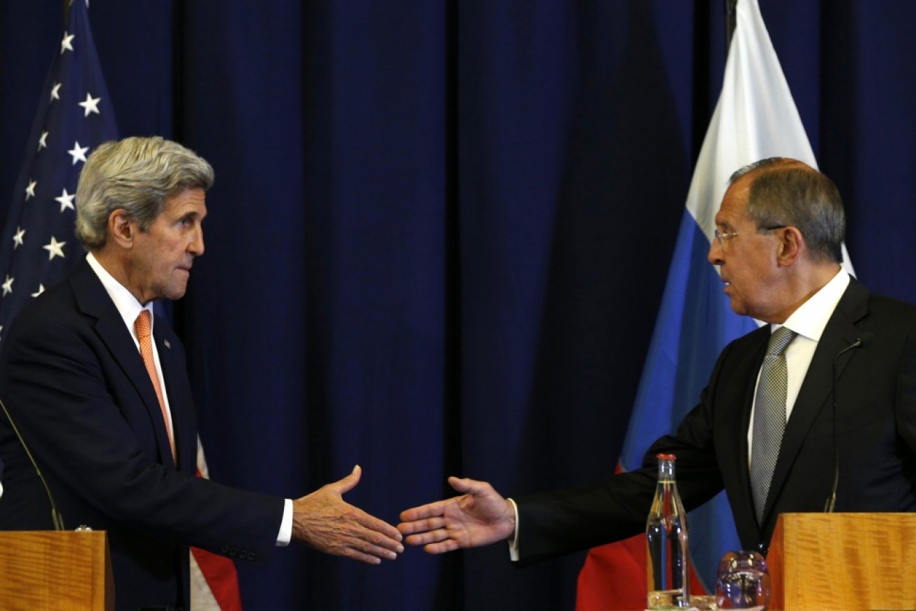 It's a deal: Kerry (left) and Lavrov shake hands on Syria.