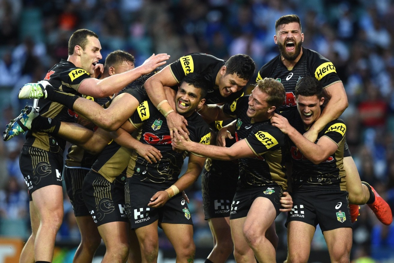 The Penrith Panthers celebrate their emphatic win over the Bulldogs.
