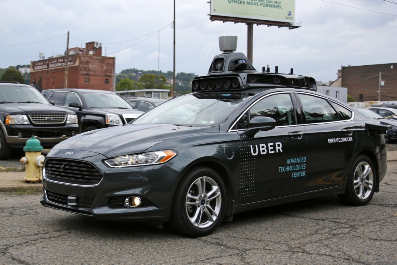 A self driving Uber car drives through Pittsburgh, US on Wednesday.