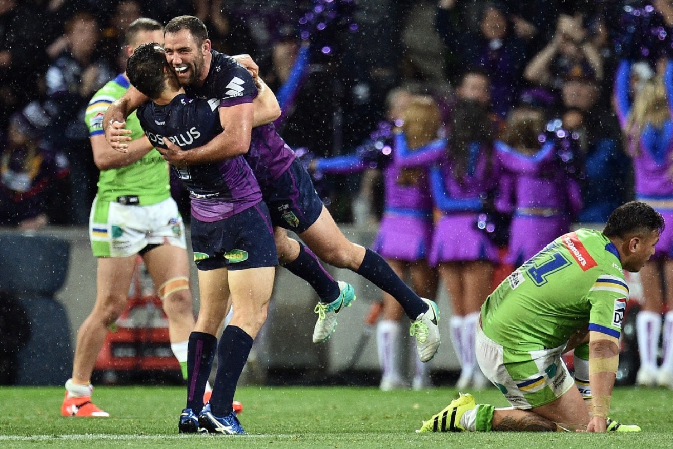 Melbourne captain Cameron Smith and 300-gamer Cooper Cronk show their elation as the Storm progress to the NRL Grand Final.