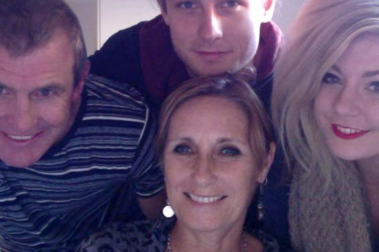 Phil Walsh (left) with his wife Meredith, son Cy and daughter Quinn.