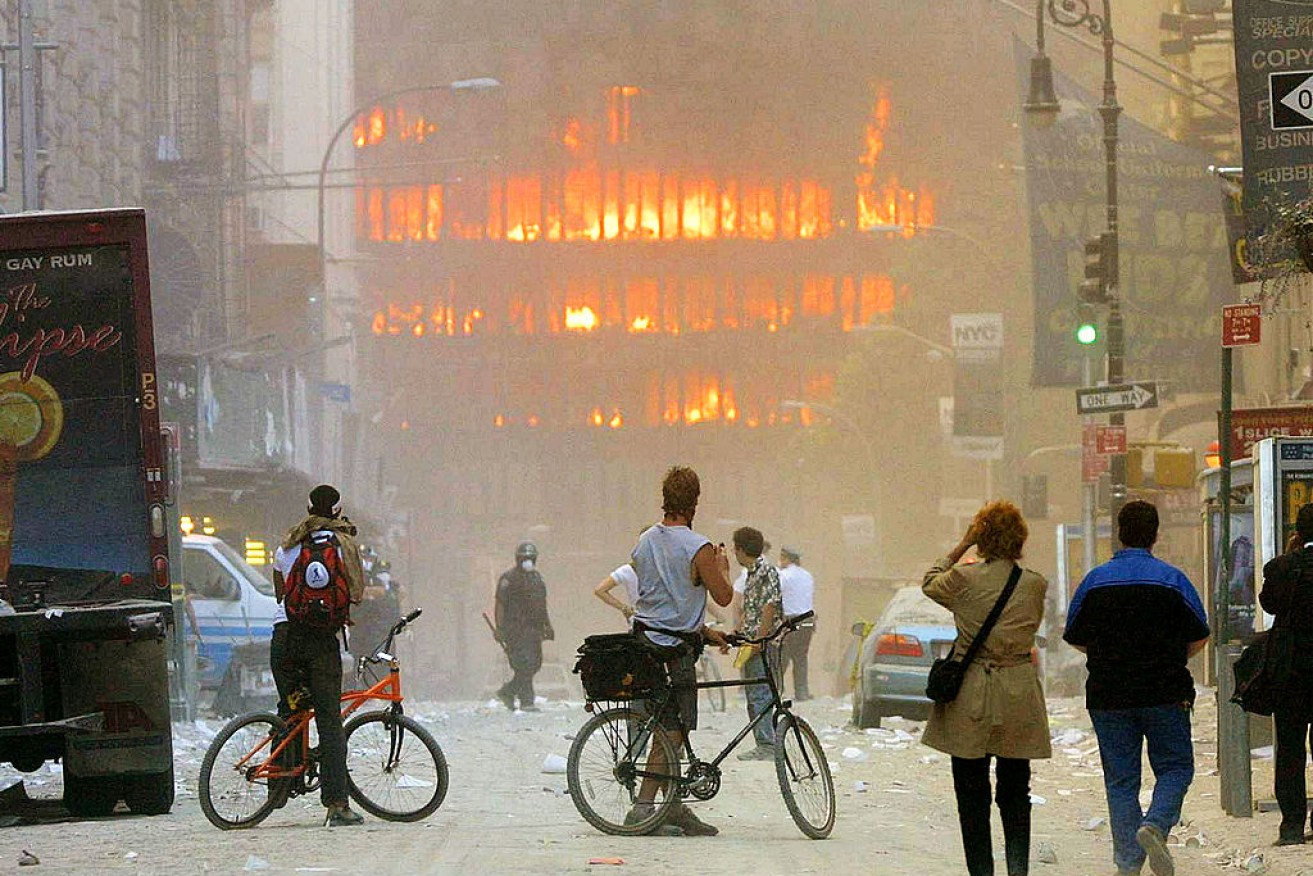 New Yorkers look on after two planes hit the World Trade Centre in 2001. 