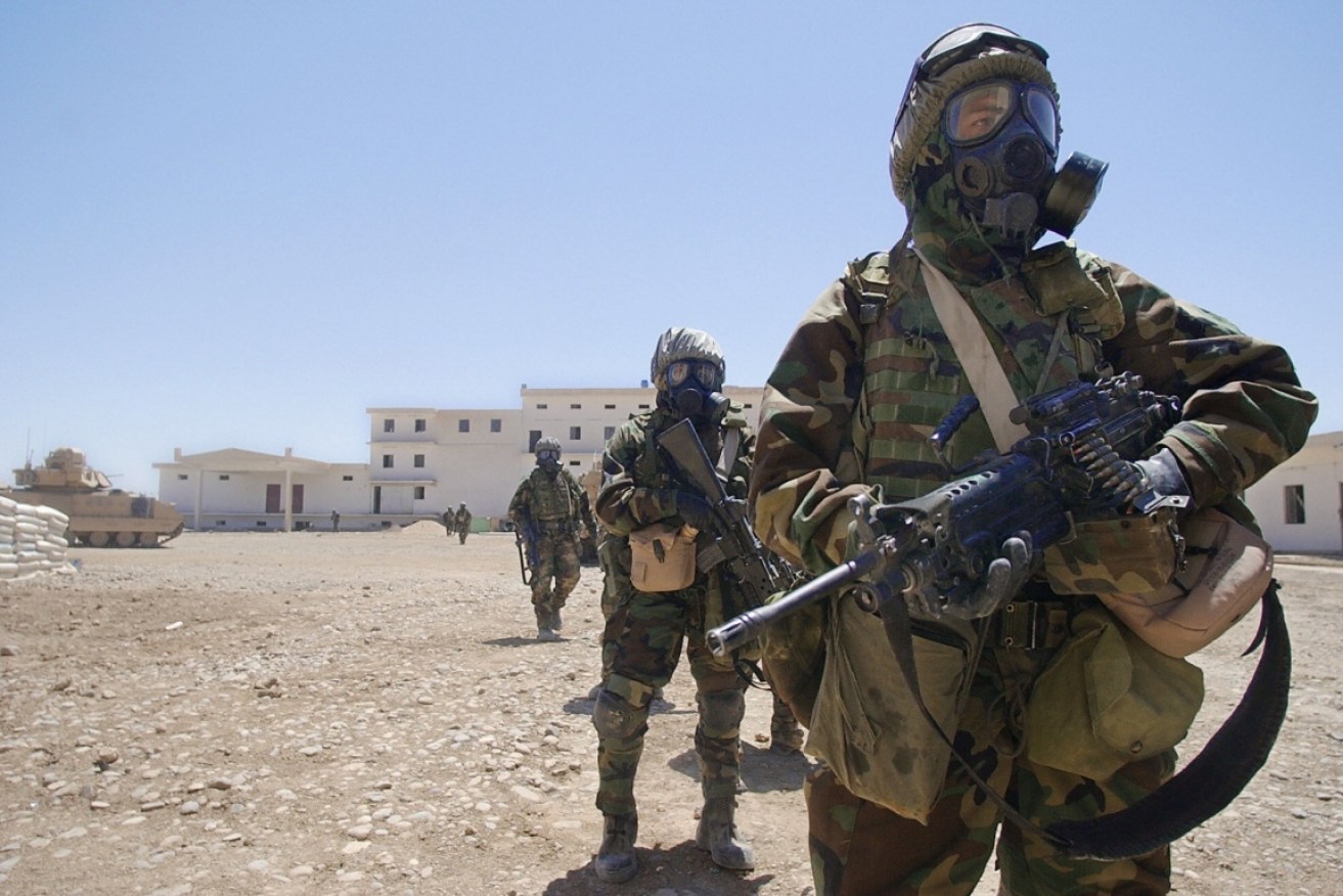 US Army soldiers in full chemical protection suits in Iraq.