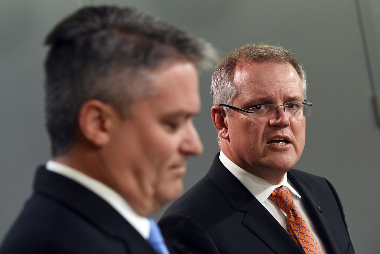 Australia's Treasurer Scott Morrison (R) and Minister for Finance Mathias Cormann (L) have received sobering news.