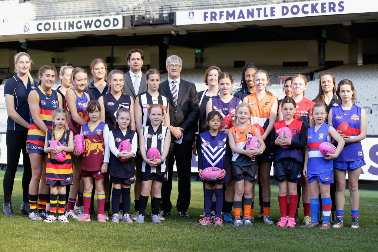 AFL chiefs, like Gillon McLachlan and Mike Fitzpatrick, are under fire for female footballer pay. 
