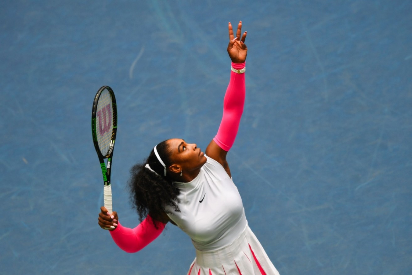 Serena Williams serves during her 307th grand slam victory. 