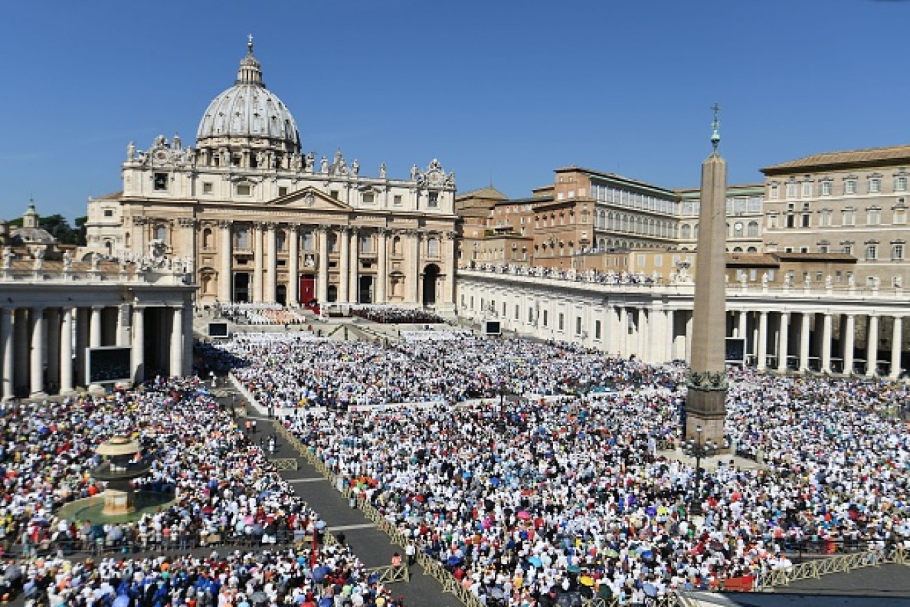 Pilgrims crowd St Peter's Basilica. 