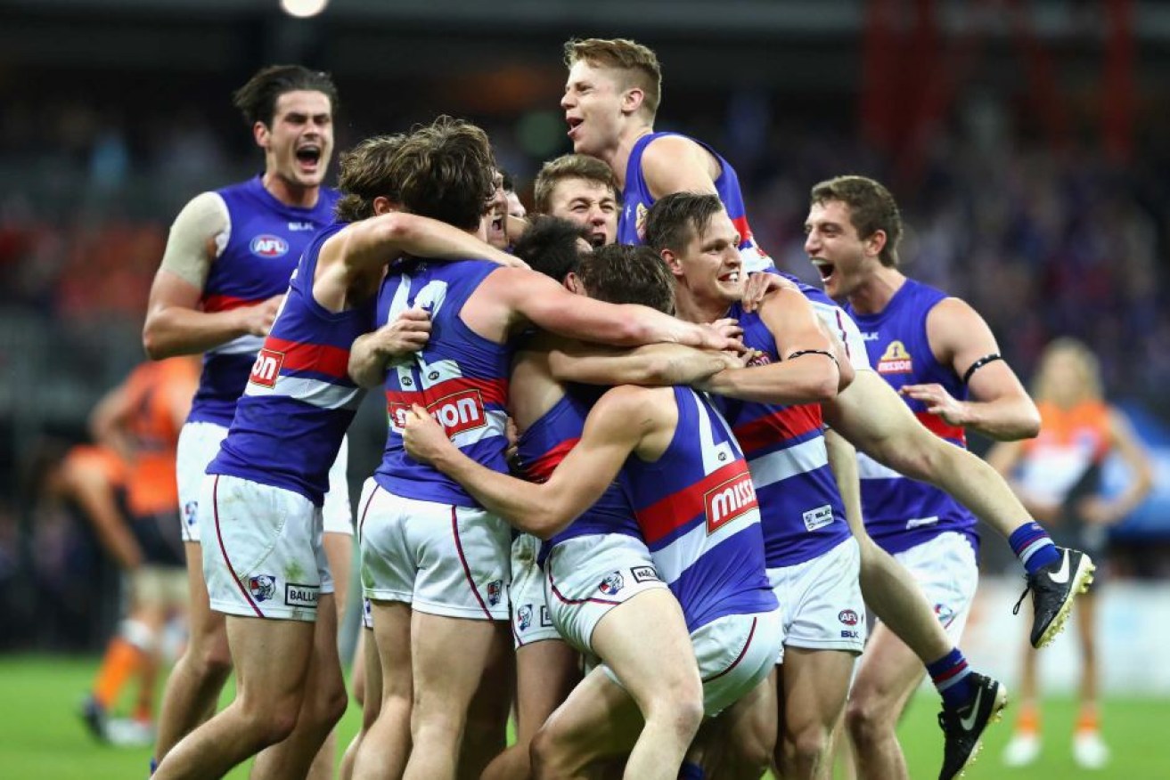 Bulldogs players celebrate victory over GWS.