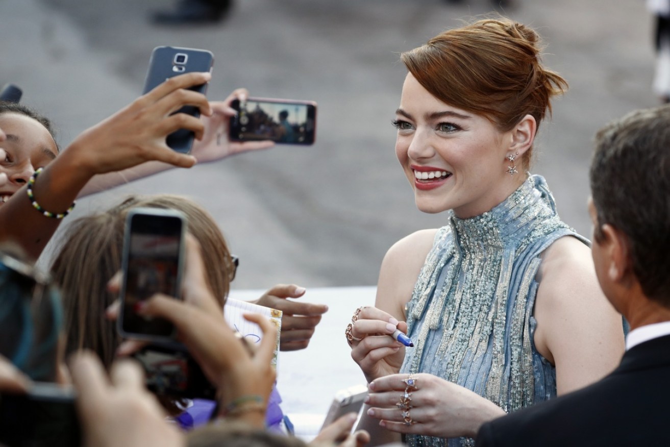 Emma Stone shone in sequins at the Italian city's famed film festival.