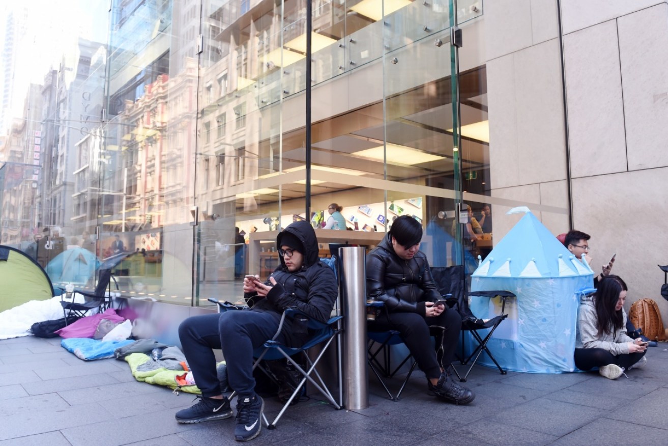 Early adopters queue overnight to be among the first to get an iPhone 7. 