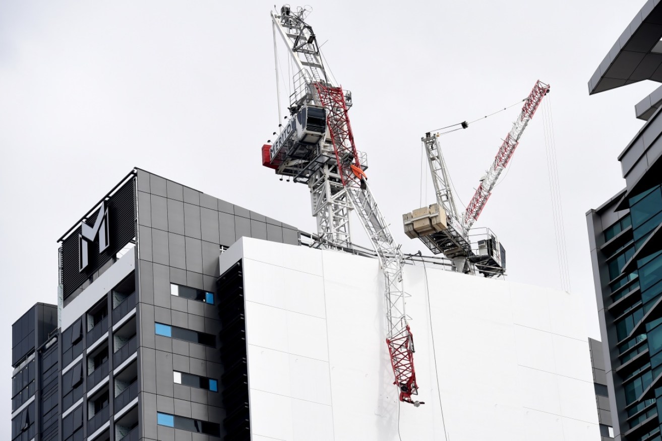 The men stuck in this crane as it collapsed are 'lucky to be alive'. 