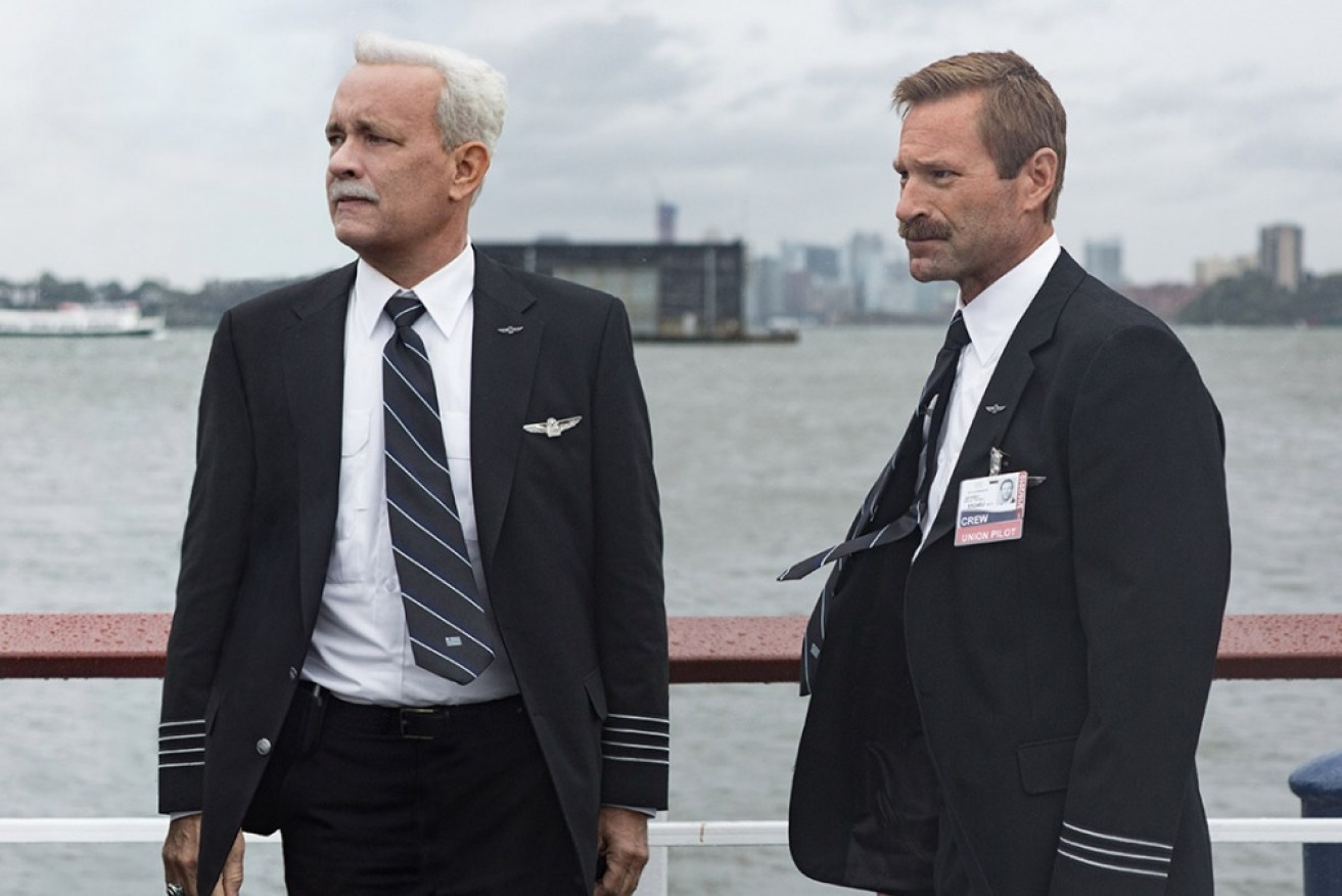 Tom Hanks as Captain Sully (left) and Aaron Eckhart as his co-pilot, Jeff Skiles.