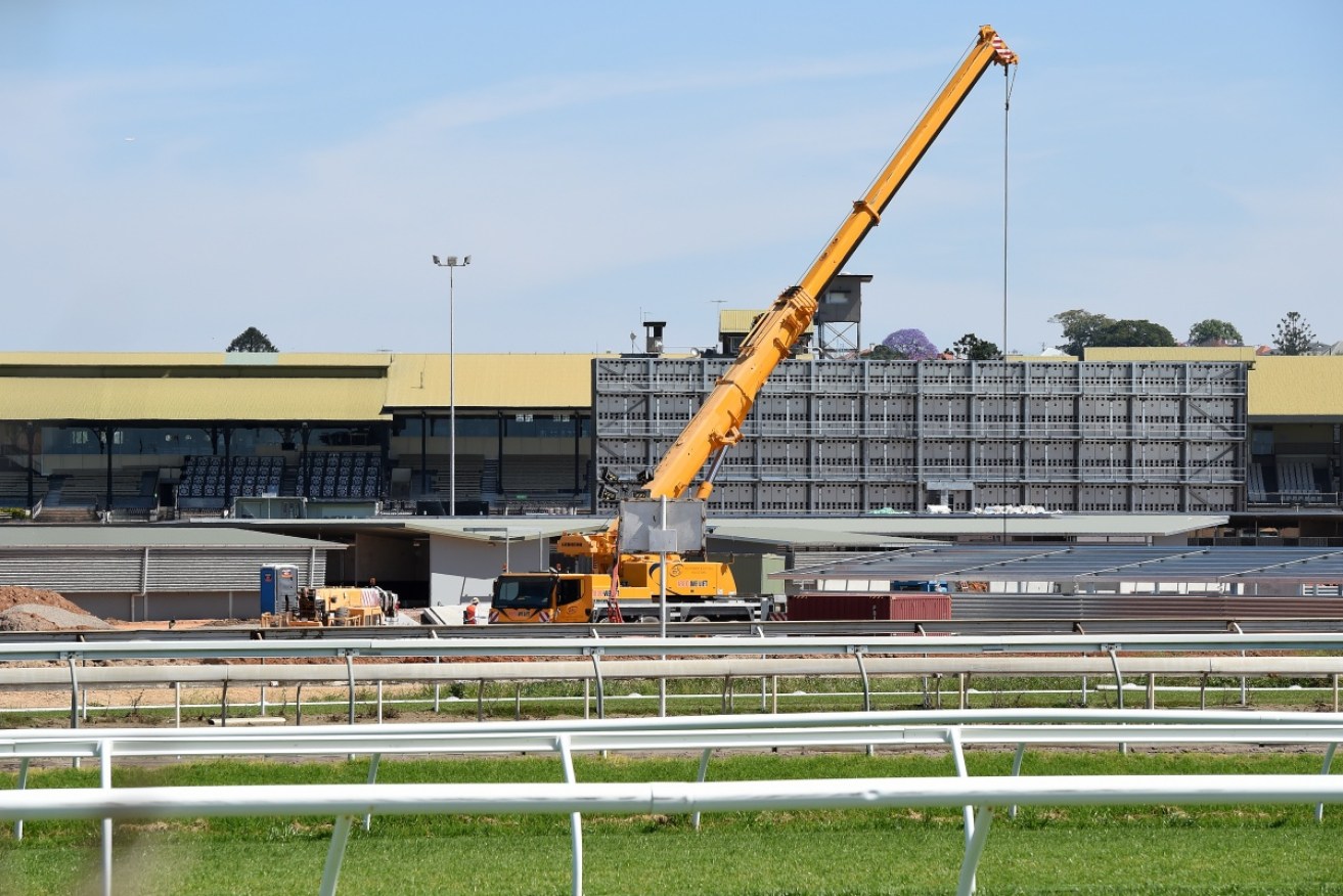 A crane at Eagle Farm Racecourse in Brisbane, the day after two workers died in a workplace accident.
