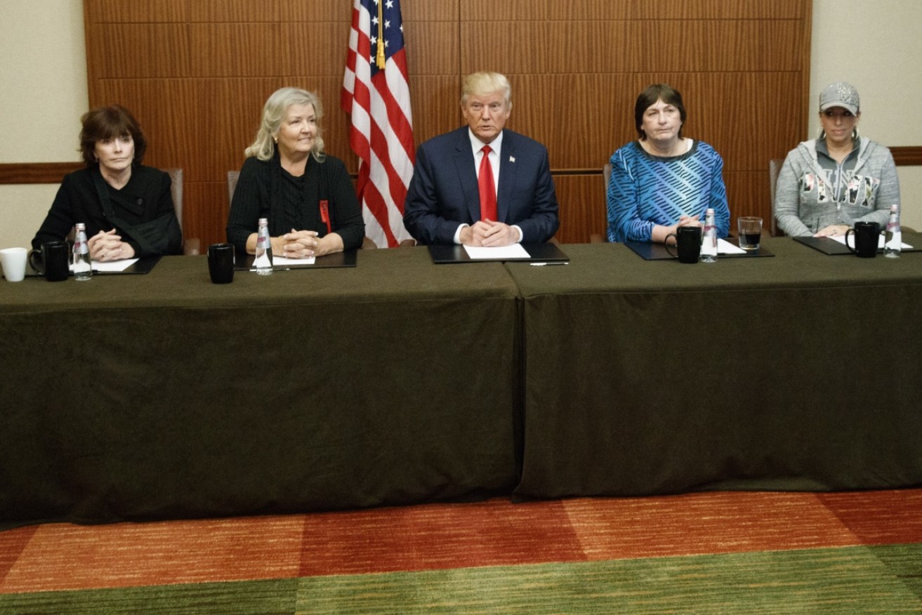 Donald Trump, sits with, from right, Paula Jones, Kathy Shelton, Juanita Broaddrick and Kathleen Willey.