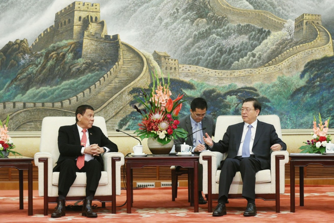 Rodrigo Duterte (left) and China's Zhang Dejiang hold talks in the Great Hall of the People in Beijing. 
