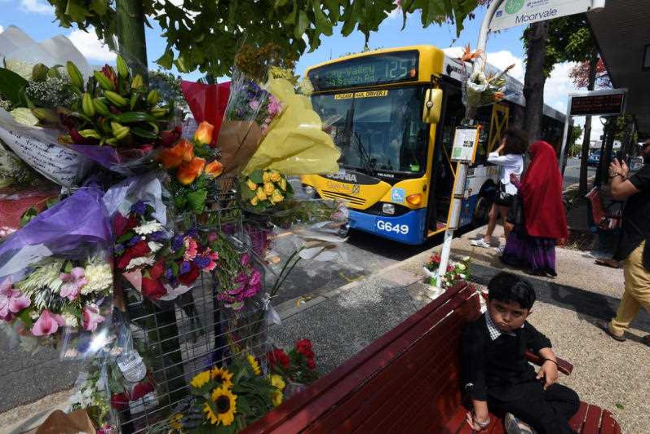 A floral tribute at the bus stop in Morooka, Brisbane, where driver Manmeet Alisher died.