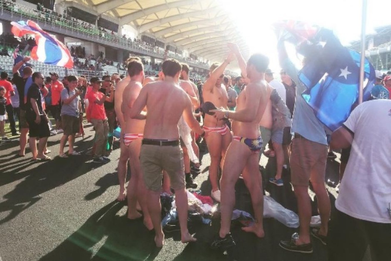 The Australian men stripped off their clothes to reveal Malaysian flag underwear.