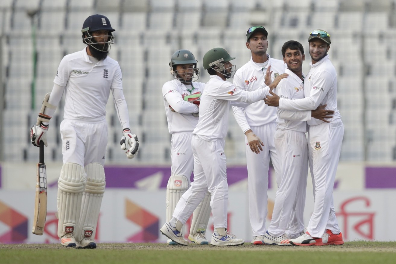Bangladesh celebrates after the dismissal of England's Moeen Ali during the second Test.