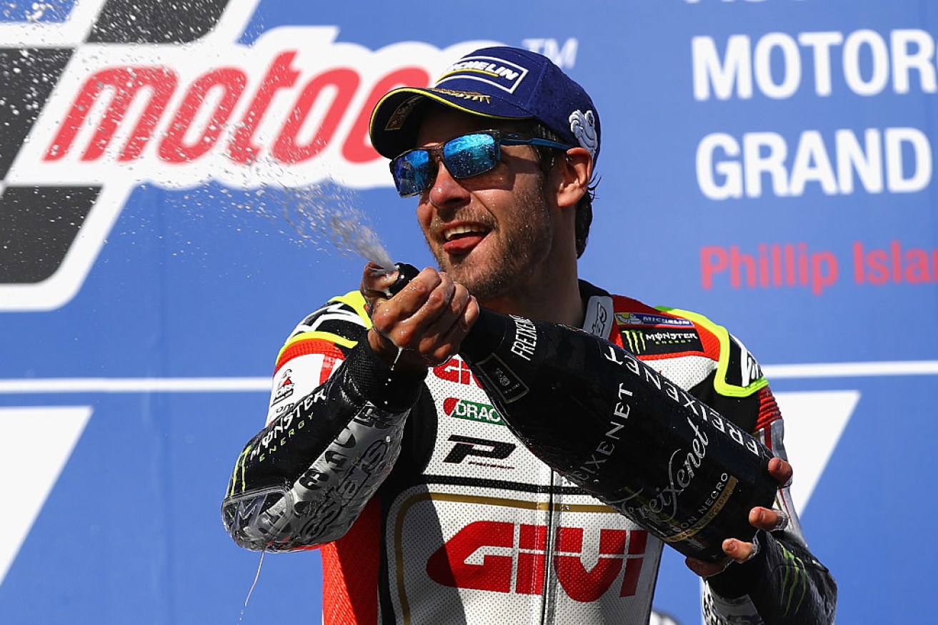Cal Crutchlow celebrates on the podium after winning the Australian MotoGP.